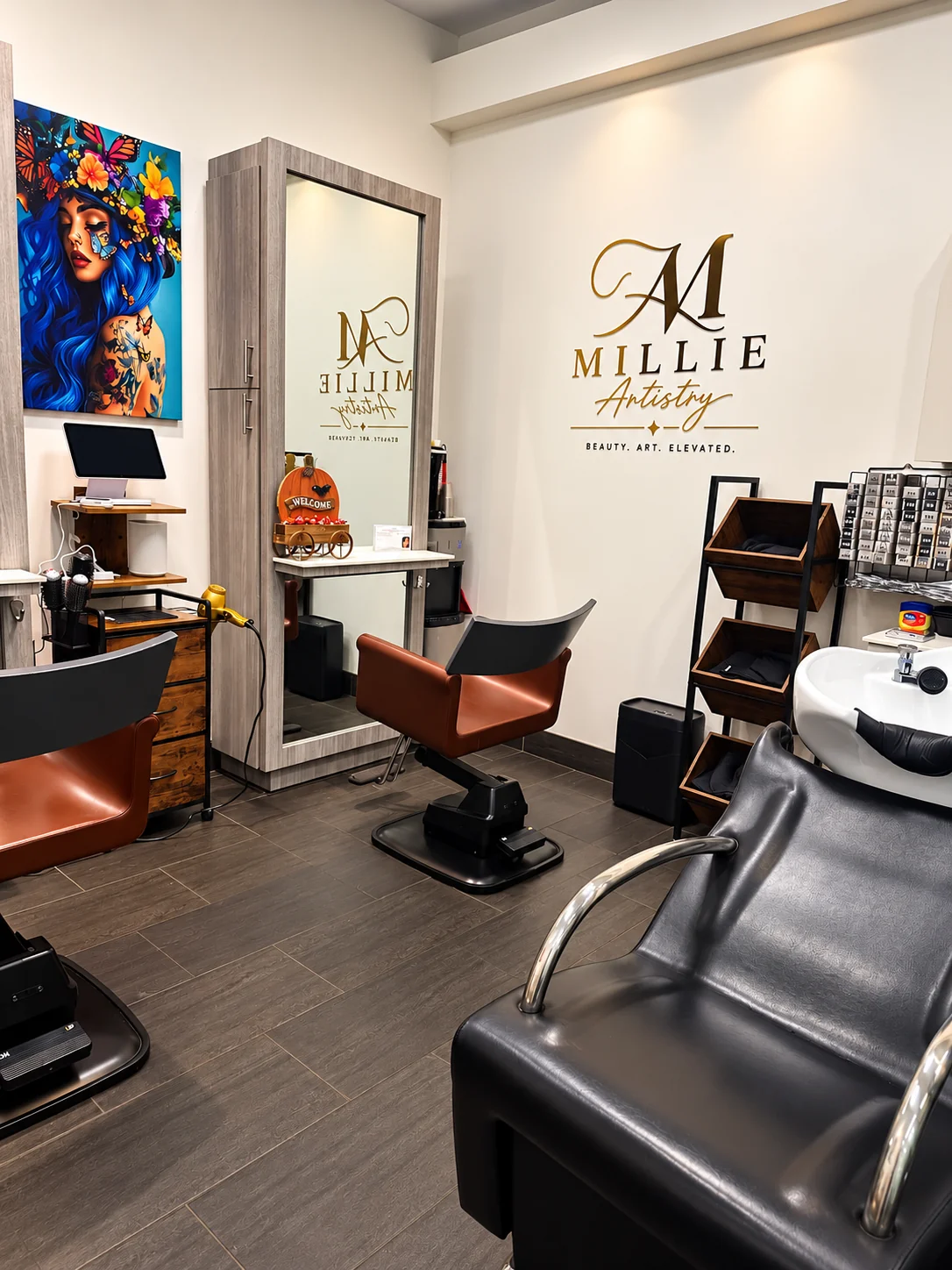 Styling chairs and Millie Artistry logo in the salon